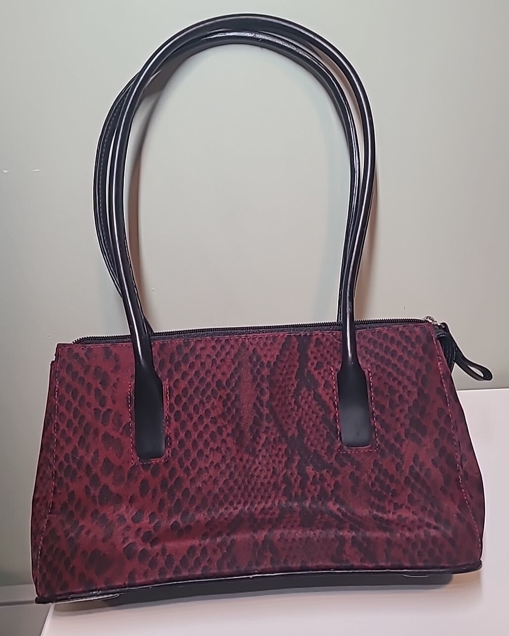 Red Leopard like Print Purse with stiff black handles Polyester w/ Vinyl Trim