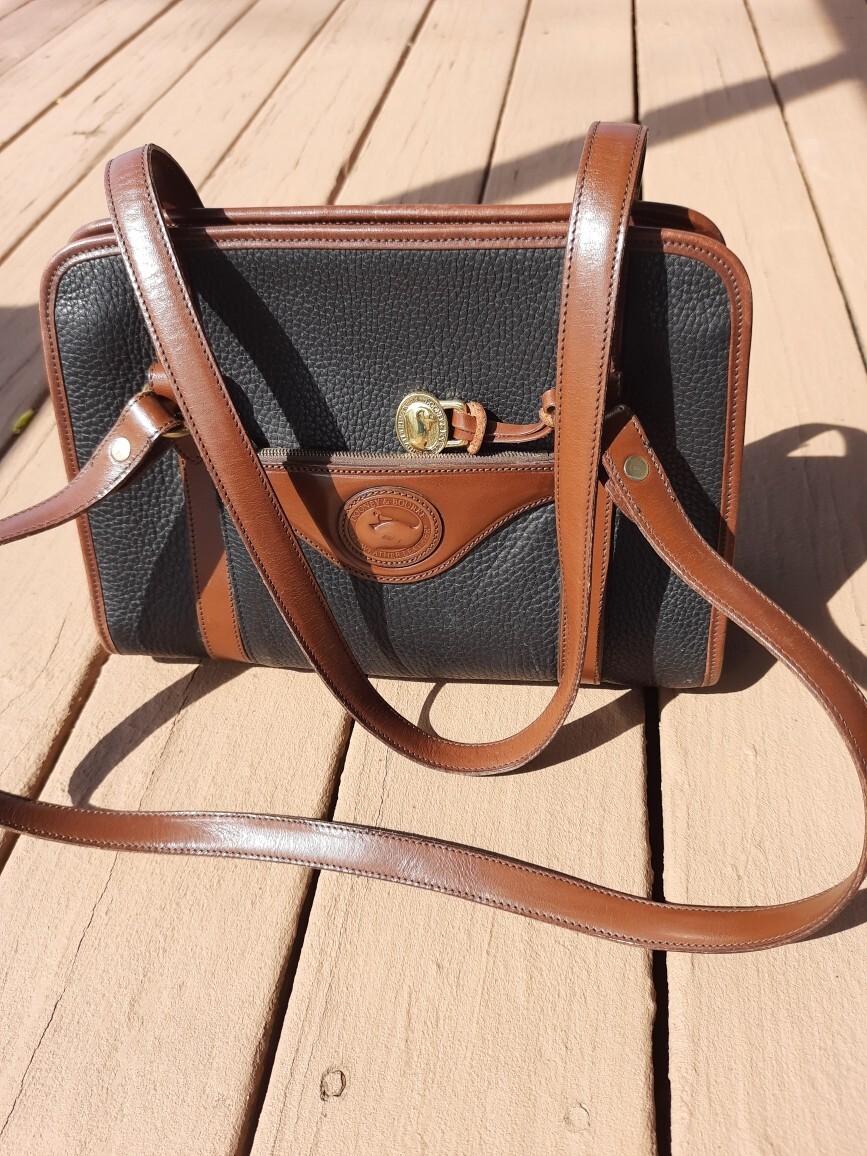 Dooney and Bourke Black With Brown Trim Leather Handbag