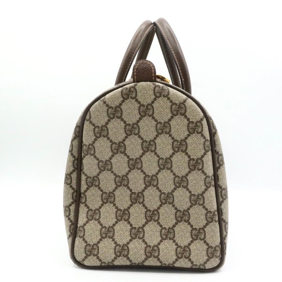 Gucci PVC canvas leather handbag, brown.