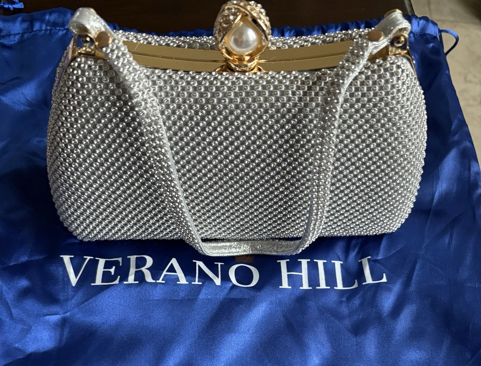 Verano Hill Silver With Gold Trim And Pearl Clasp evening clutch bag.