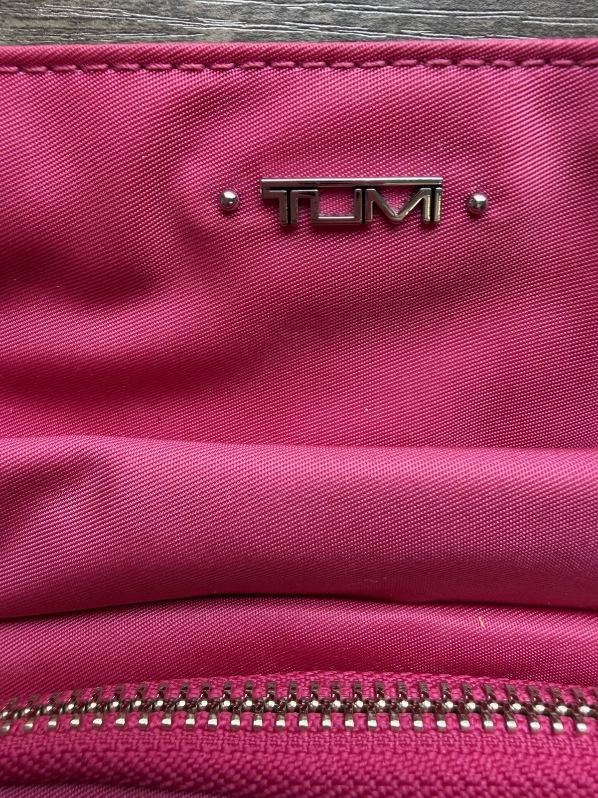 Tumi Pink Crossbody Bag Adjustable Strap Zip Closure Multiple Pockets Lined