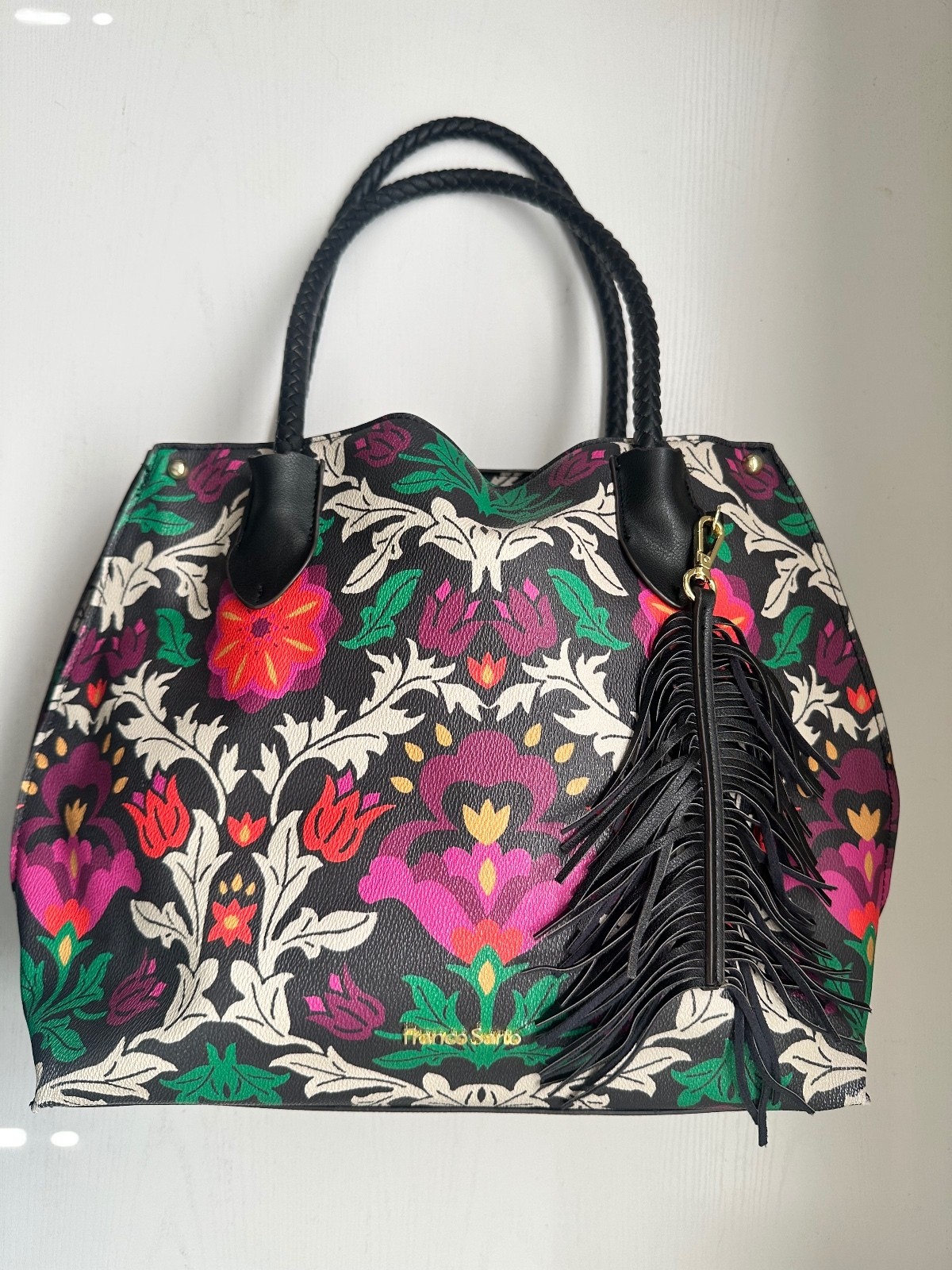 Franco Sarto floral-printed tote handbag black braided handle and fringe tassel