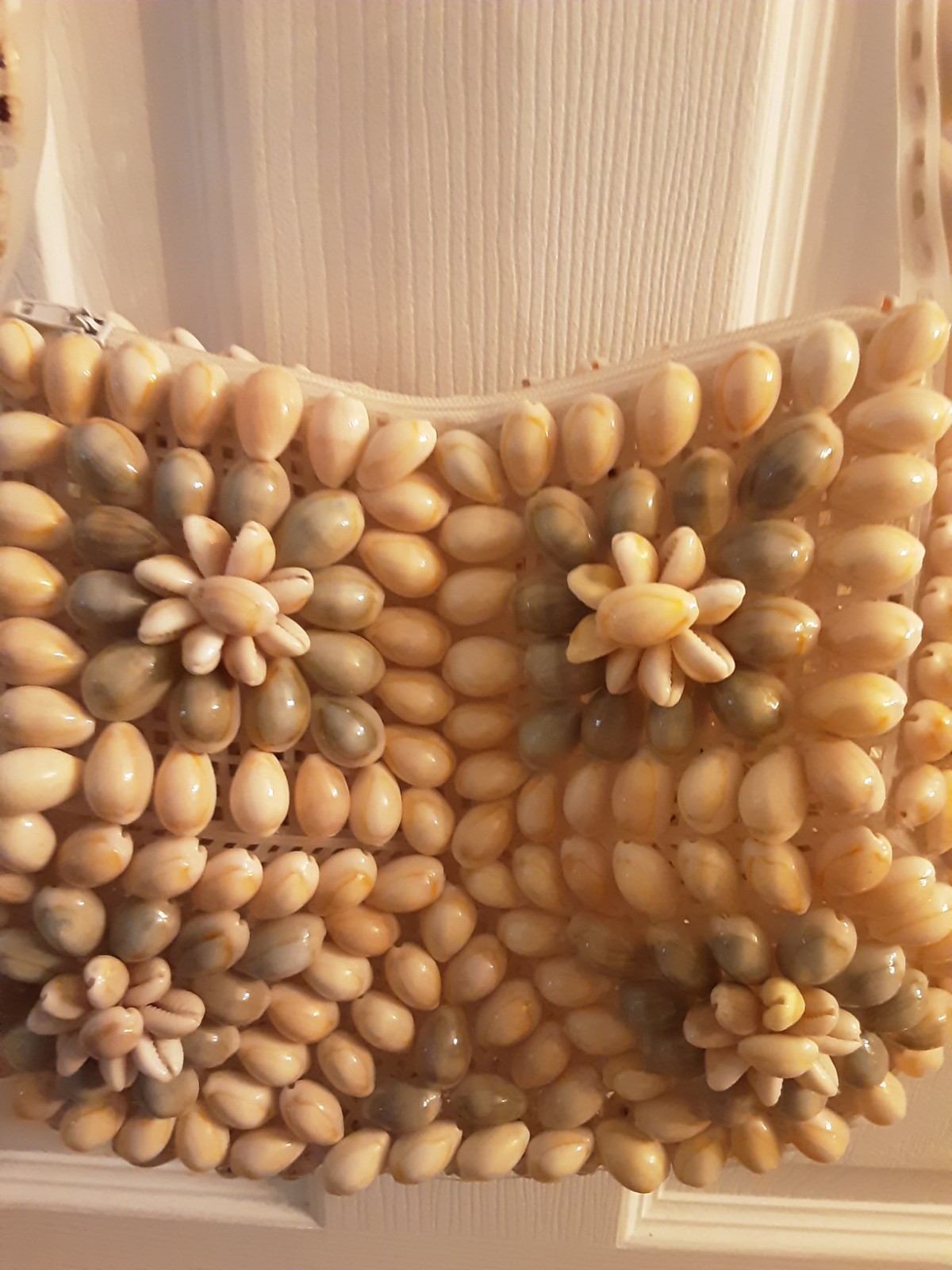 Cowrie and Nassa seashell crossbody or shoulder Handbag flower motifs.