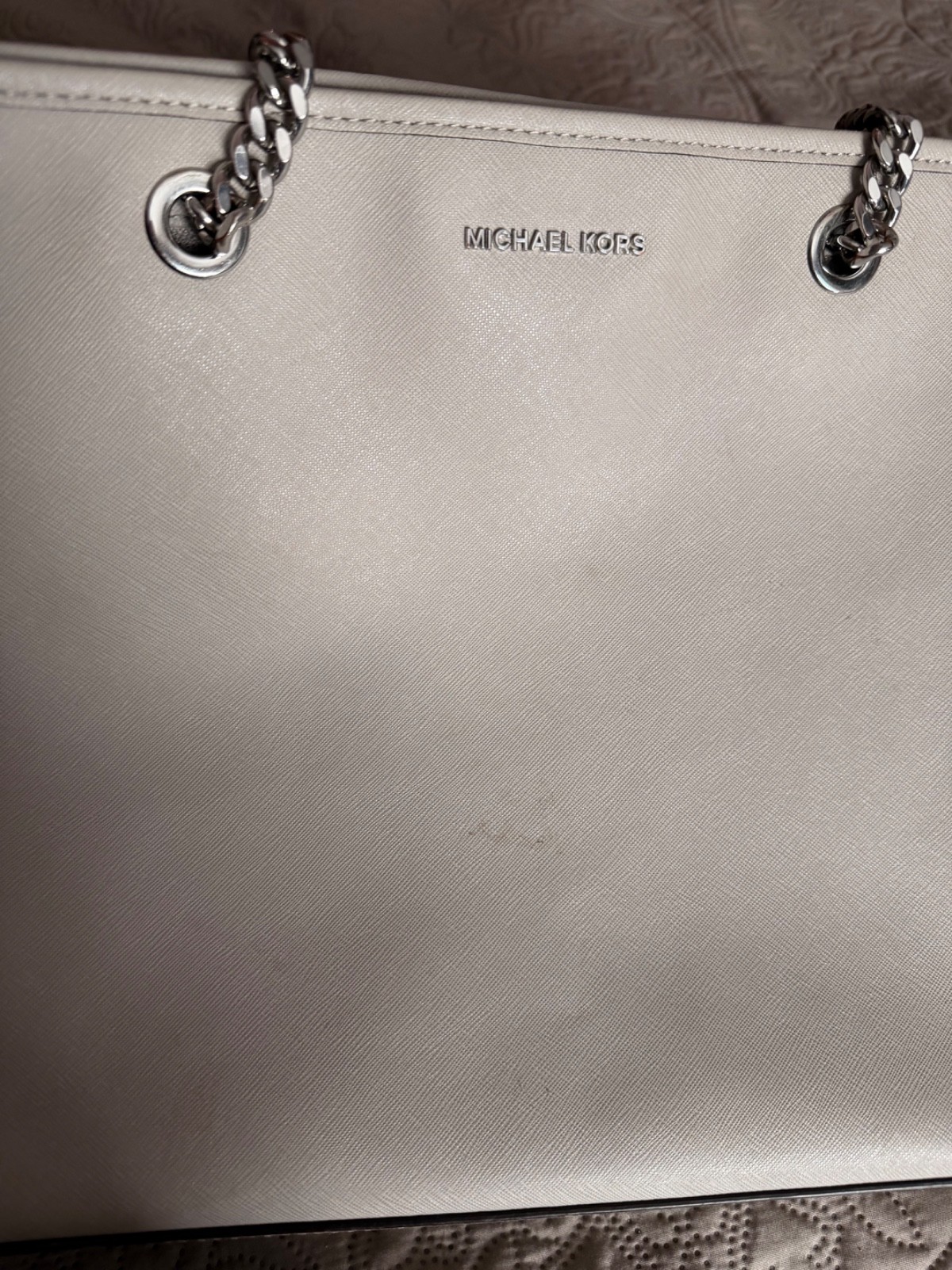 Large gray Michael Kors handbag with silver toned chain straps