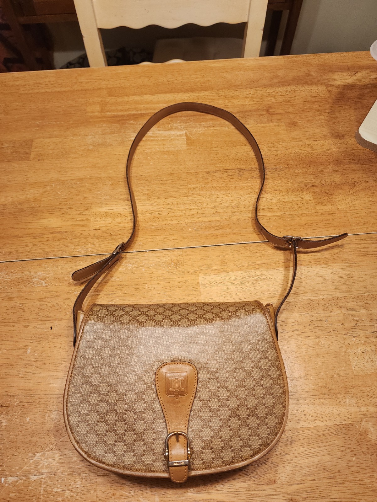 vintage Celine Macadam saddle bag featuring the signature brown monogram coated