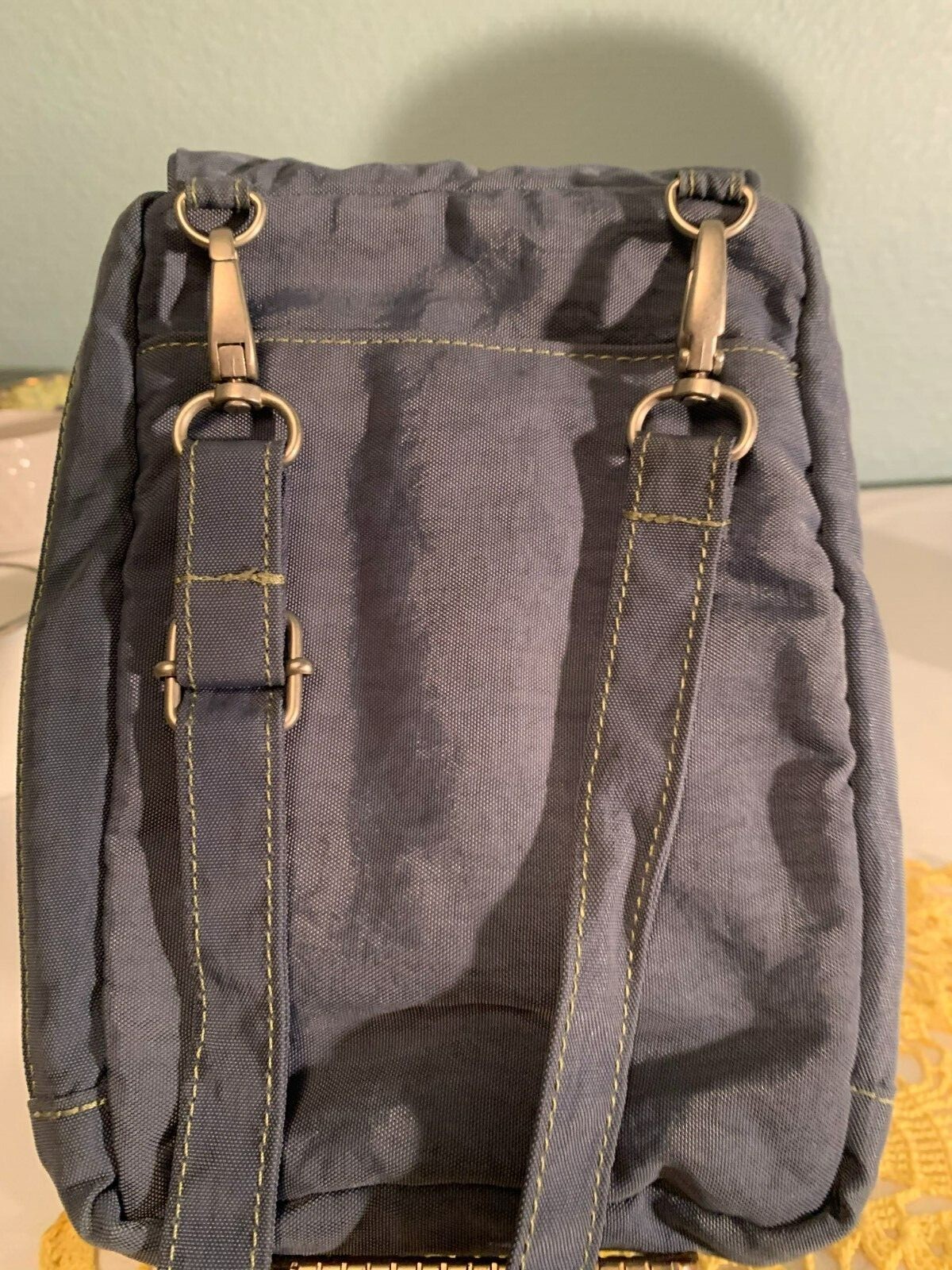 Gray Baggellini cross body purse 6″ X 9″, in good shape w/ several compartments