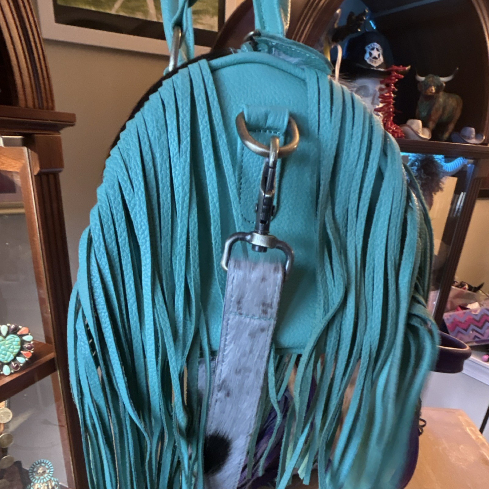 Women’s Western Turquoise mini hide speedy.