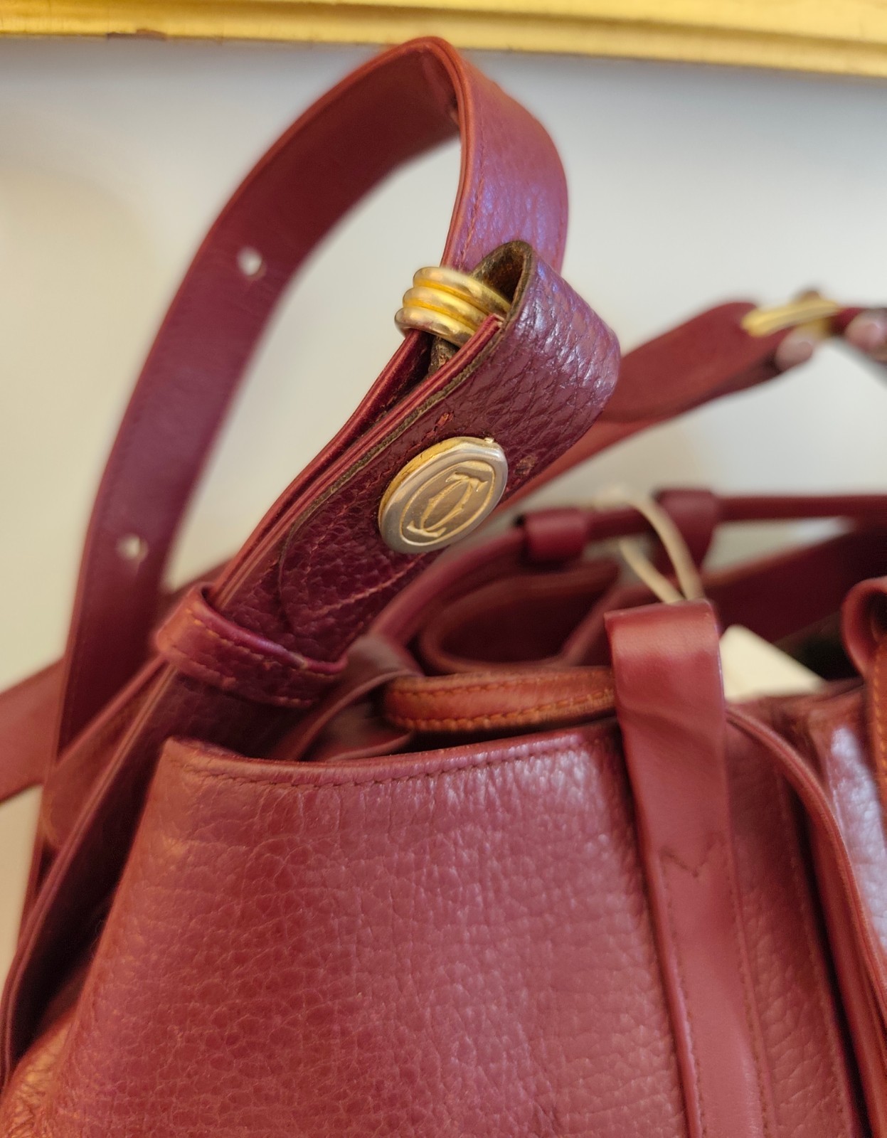 Cartier Oval Bucket Bag With Drawstring In Bordeaux Leather, 30x28x10 cm
