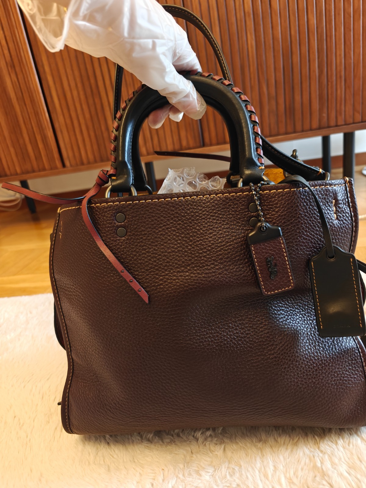 Coach Rogue 31 with whipstich in oxblood