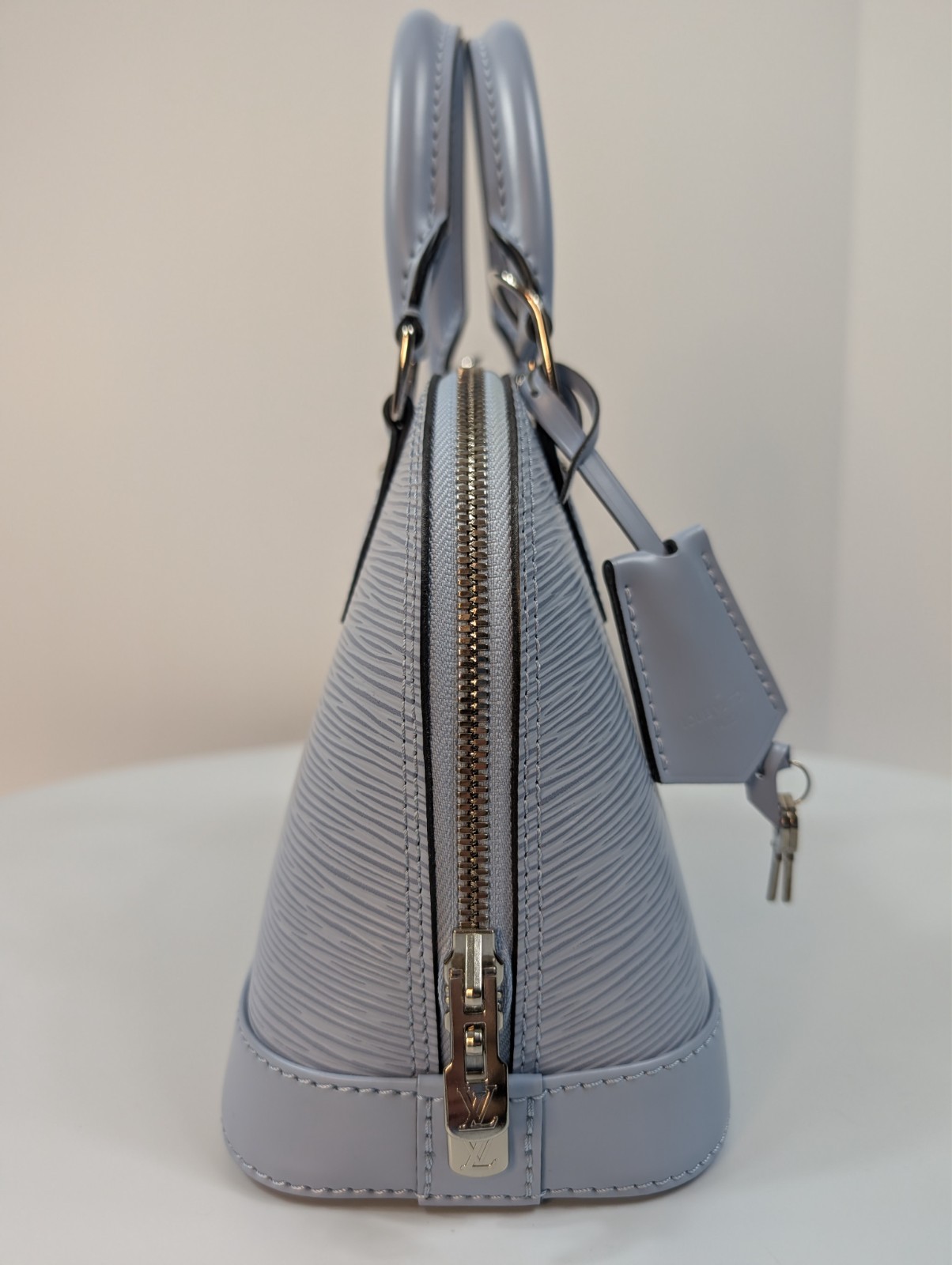 Authenticated Louis Vuitton Bleu Nuage Epi Leather Alma BB Bag