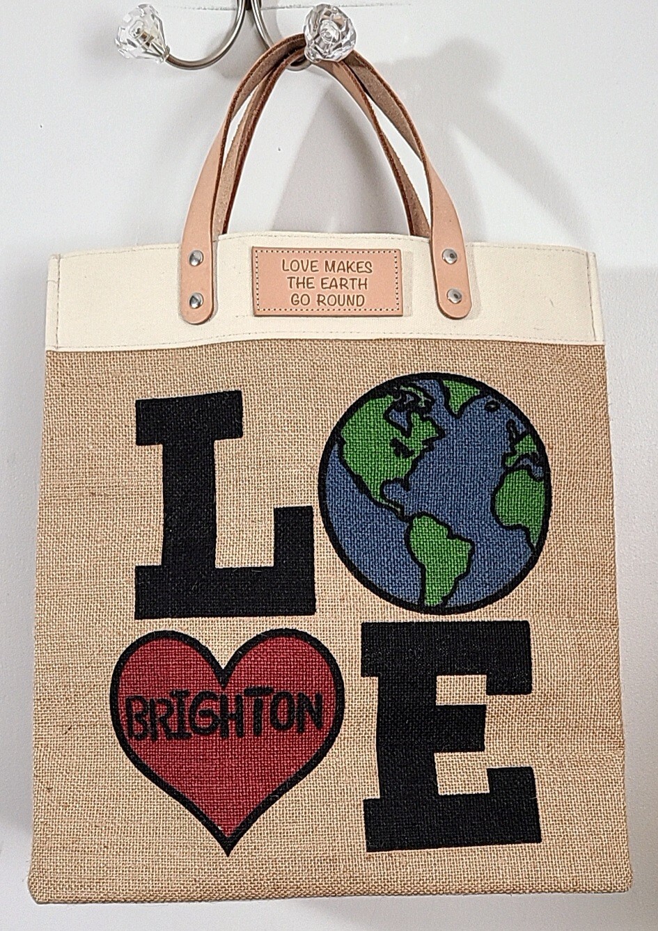 BRIGHTON JUTE/CANVAS LOVE MAKES THE WORLD GO AROUND TOTE BAG