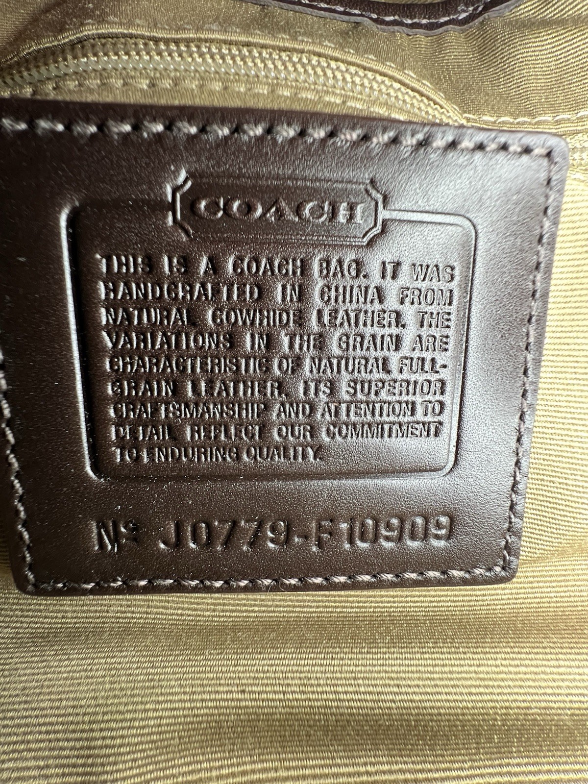 Coach Signature Medium sized Carly with matching wallet.