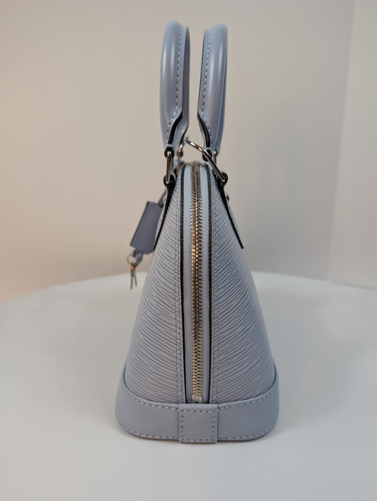Authenticated Louis Vuitton Bleu Nuage Epi Leather Alma BB Bag