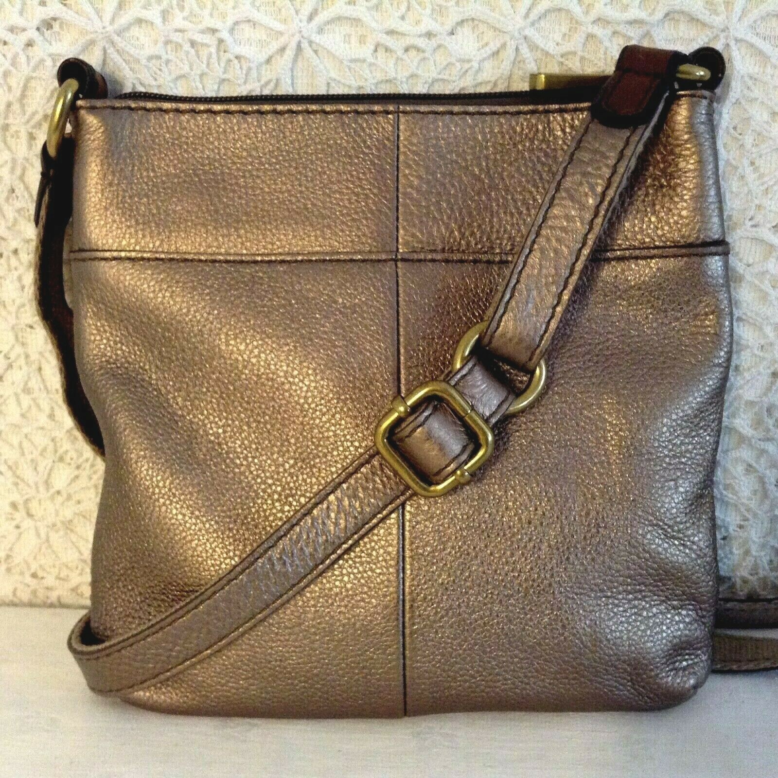 ”FOSSIL” crossbody in bronze tone glove leather and bold brass hardware