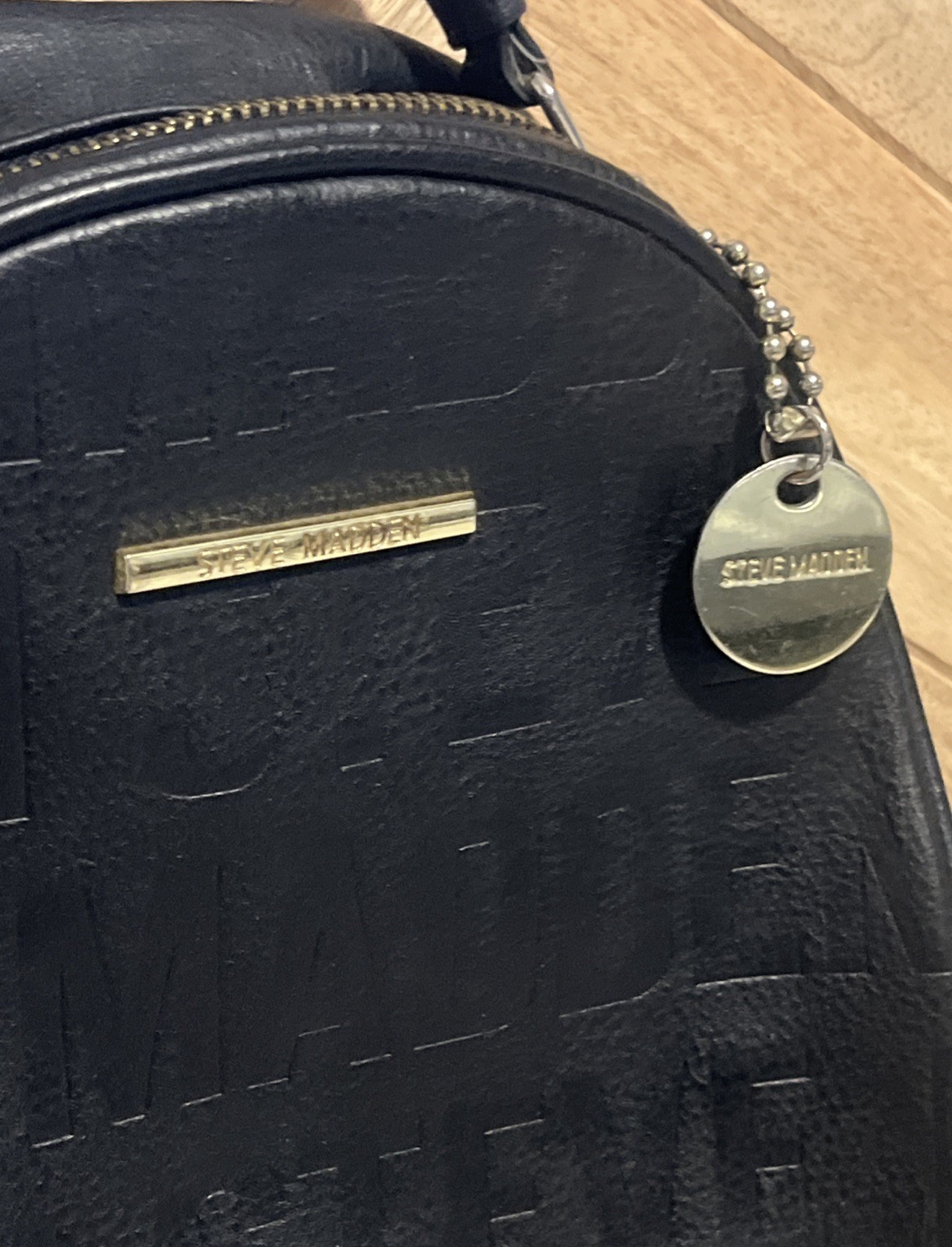 Steve Madden Small Backpack Embossed Logo Black & Gold Faux Leather Womens Bag