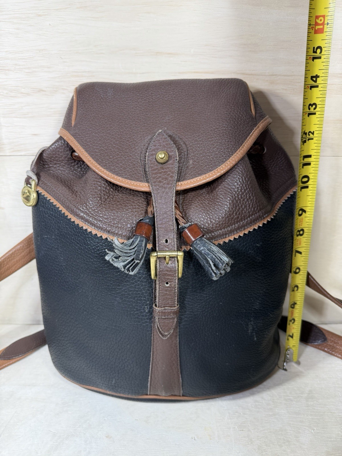 Vintage Dooney & Bourke Black Brown Pebbled Leather Drawstring Backpack Tassels