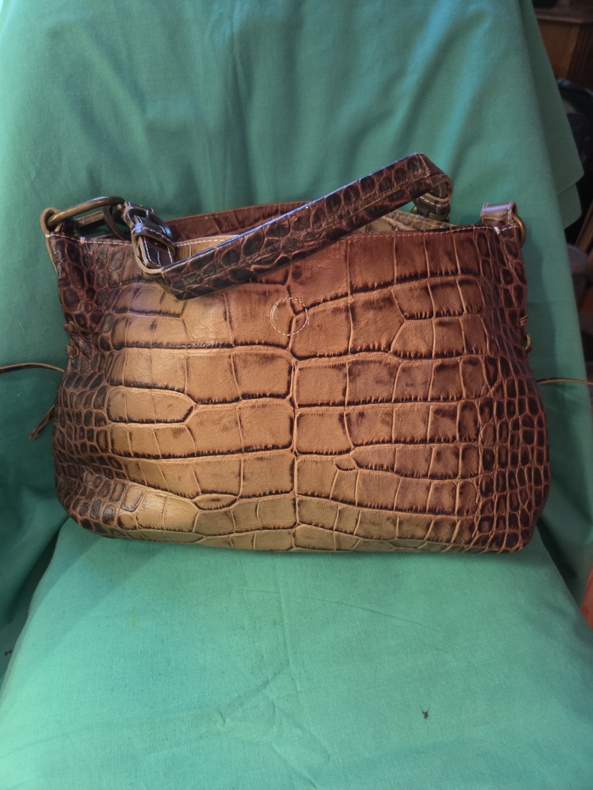 This is a Robert Pietri GENUINE LEATHER tan Crock Enbossed Bag