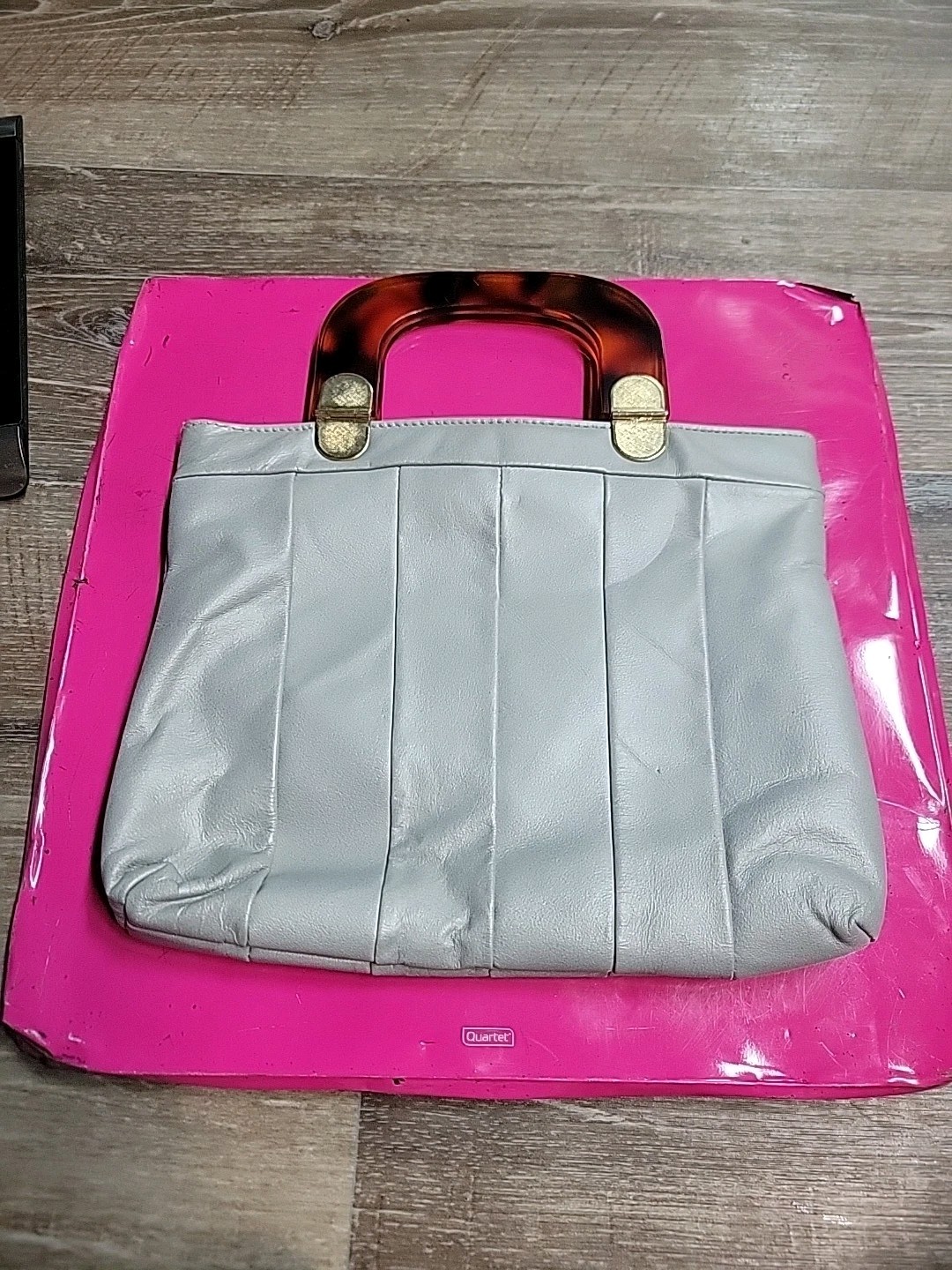 Grey leather handbag with a tortoise handle clutch purse