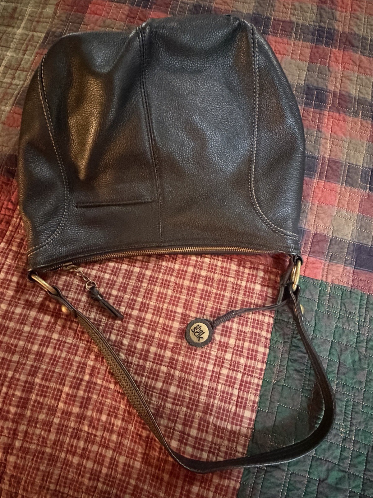 The Sak Black Pebbled Crescent Shoulder Bag Zip Top Multicolor Lining Charm