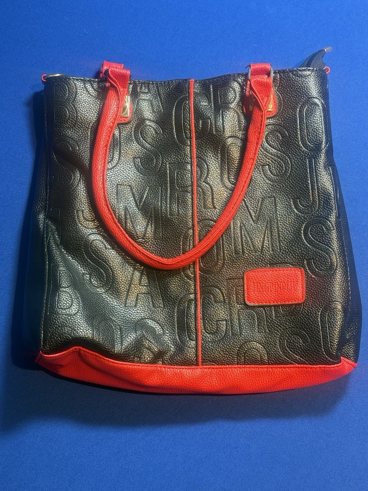 Stylish Black Embossed Tote with Red Trim Faux Leather Handbag.