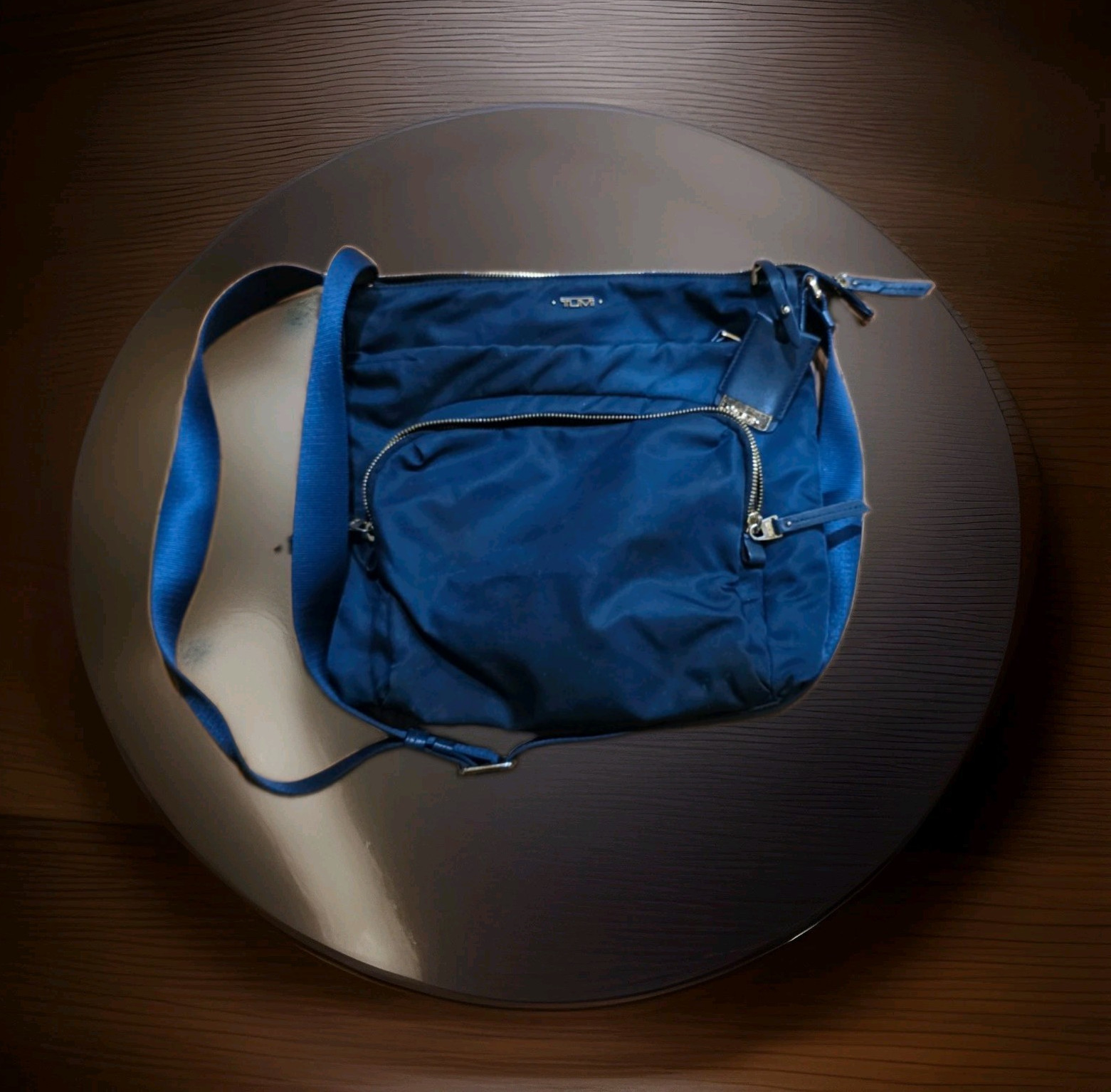 Tumi Blue Crossbody Bag Zip Closure Pockets Adjustable Strap Gold Hardware Tag