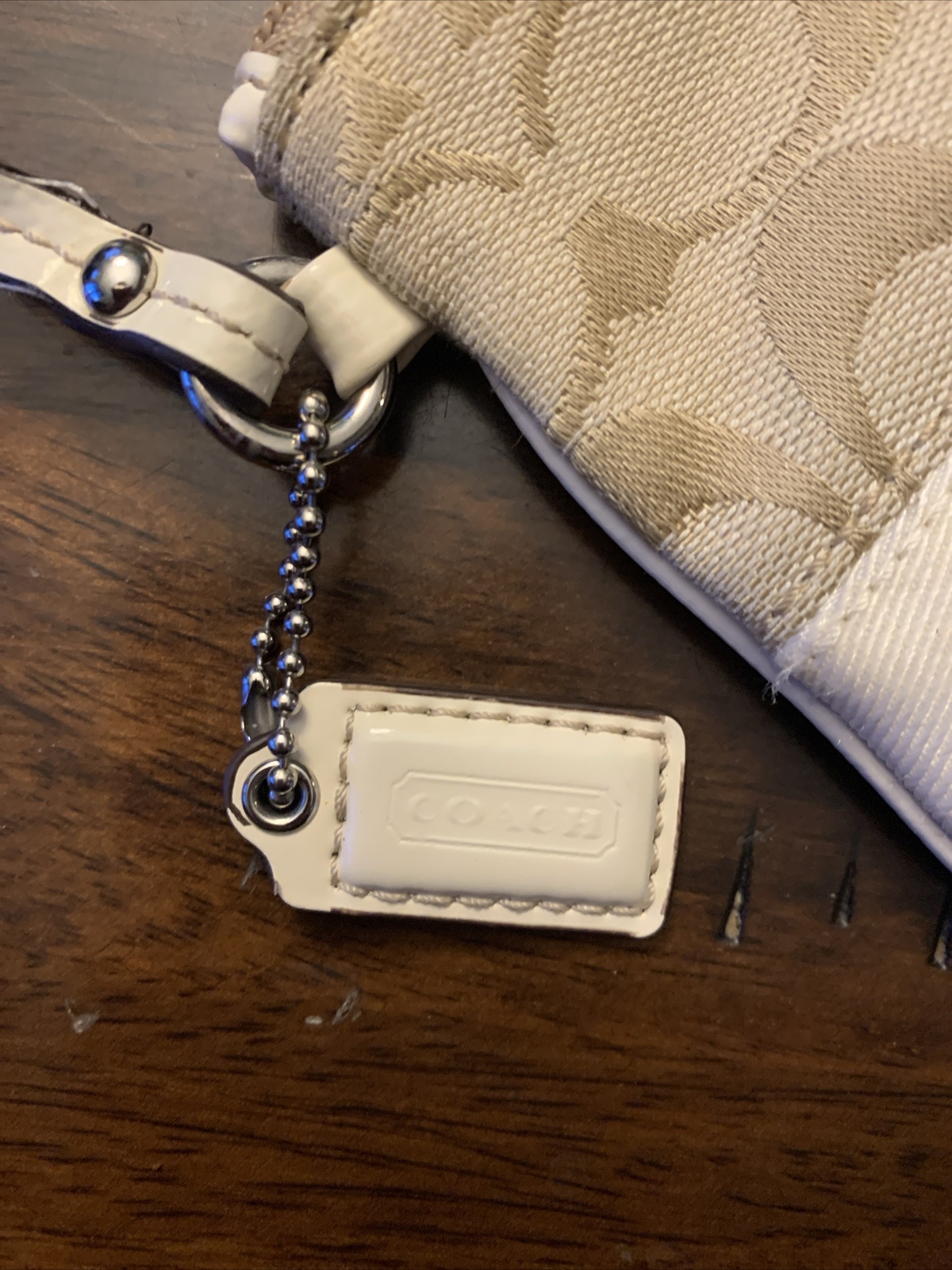 Small Beige & Ivory Coach Clutch/Wallet. Nice Condition! 4in tall & 5.75in wide.