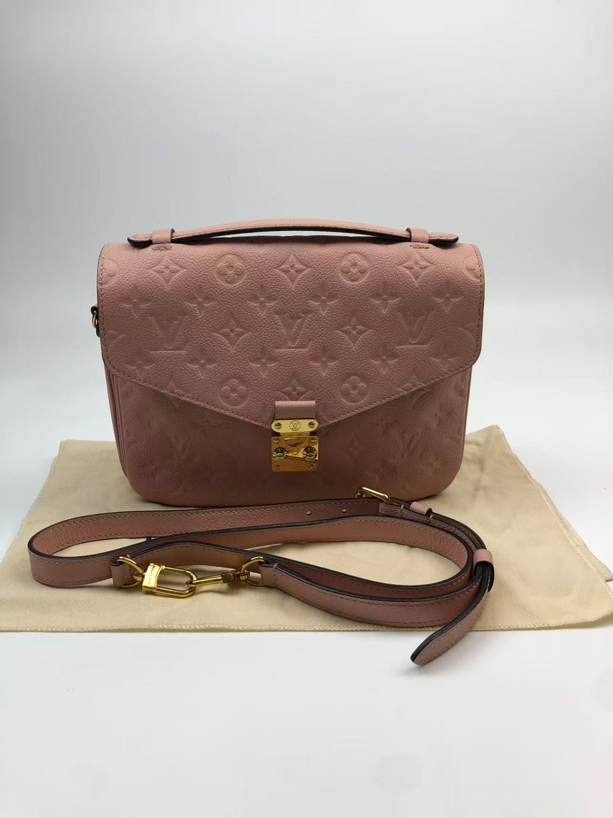 Louis Vuitton Pochette Metis Monogram Empreinte pink crossboby top handle bag