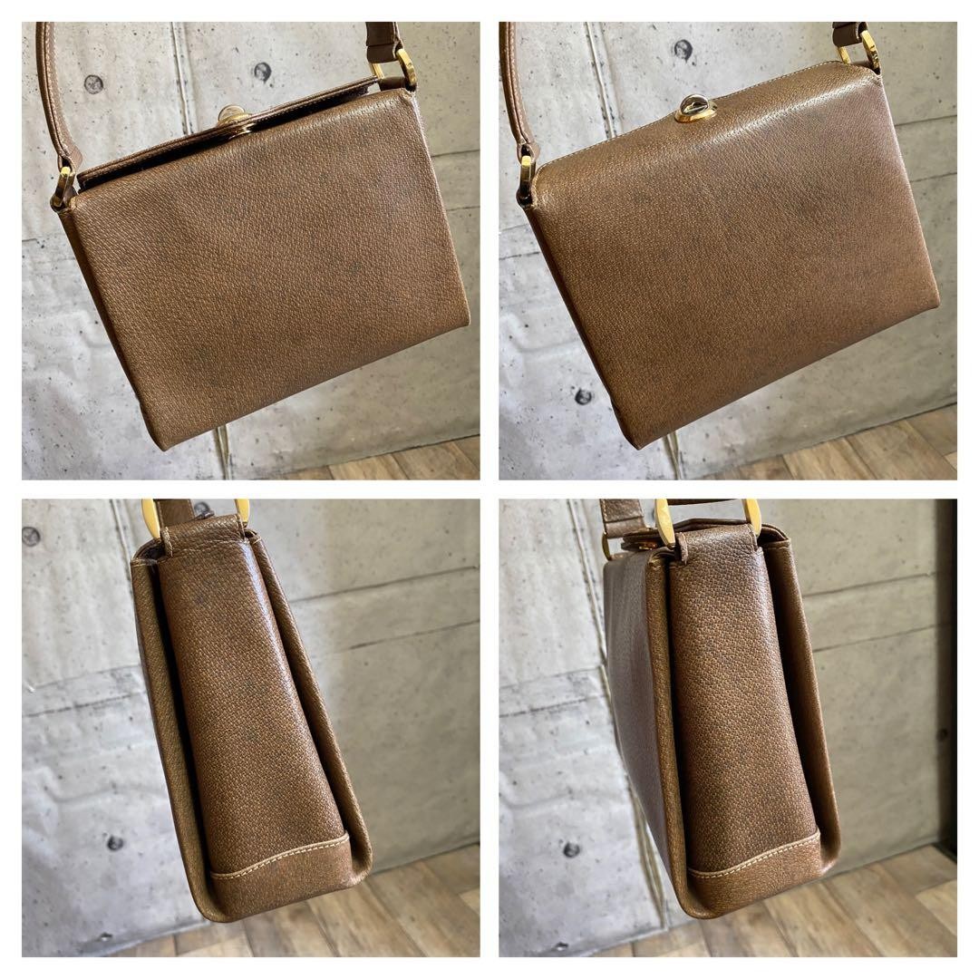 GUCCI Handbag Brown Leather Turn-lock Closure Size: WxH7 in. Strap: 18.9″