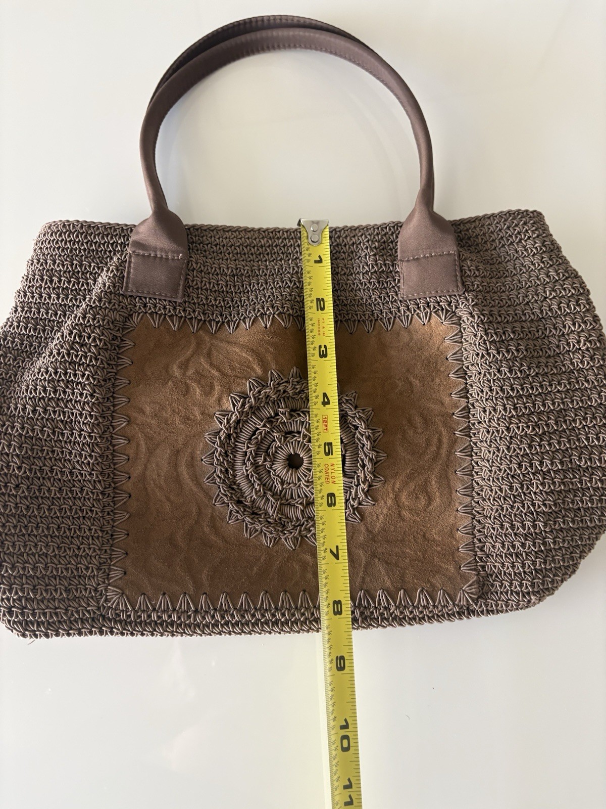 Tightly Woven bag Brown .68% Cotton/32 % olefin with man made material trim.
