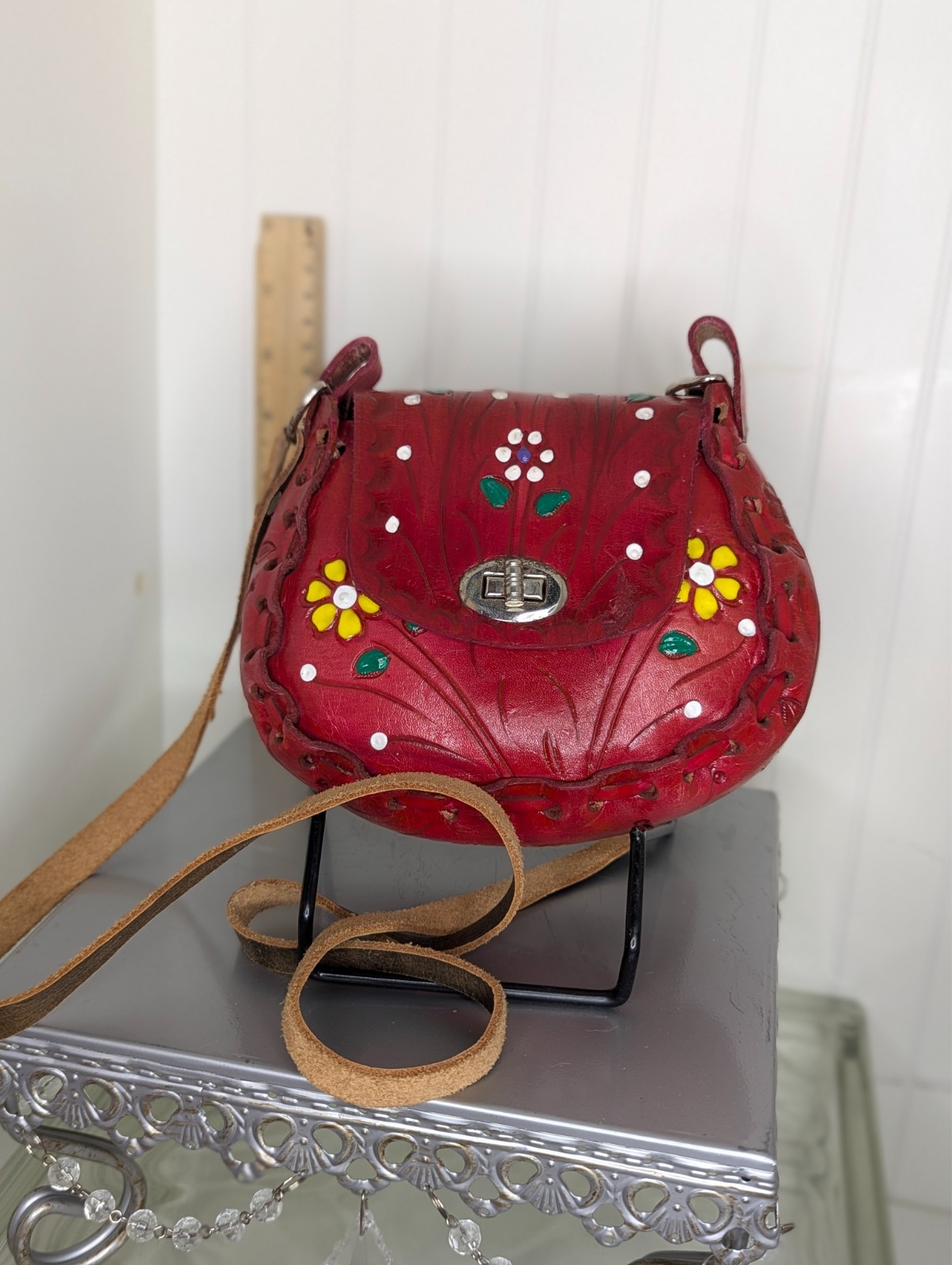 Red with flowers says Bella mexican hand tooled leather purse from Mexico