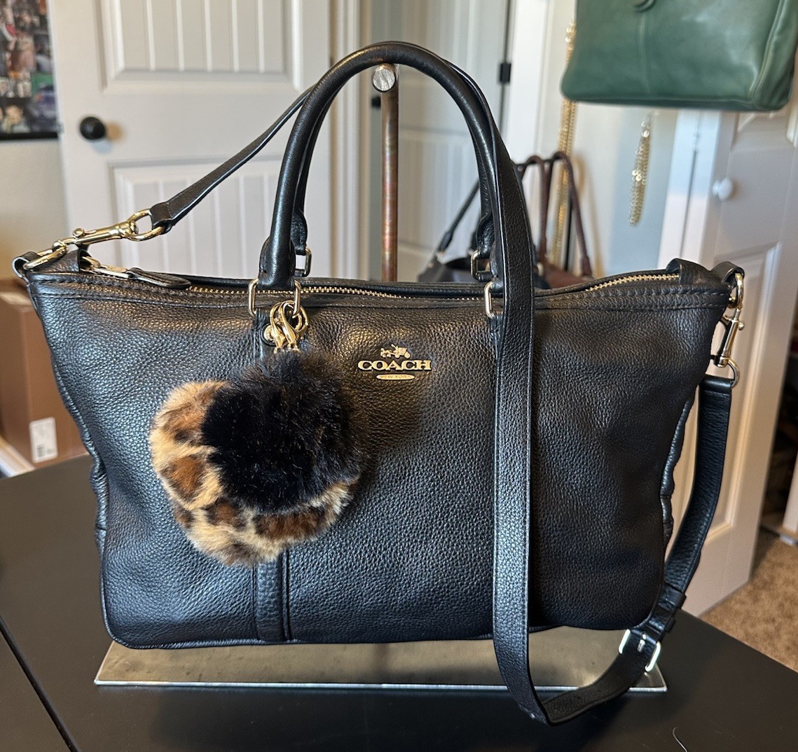 EUC Coach Central satchel in black pebbled leather with strap and hangtag.
