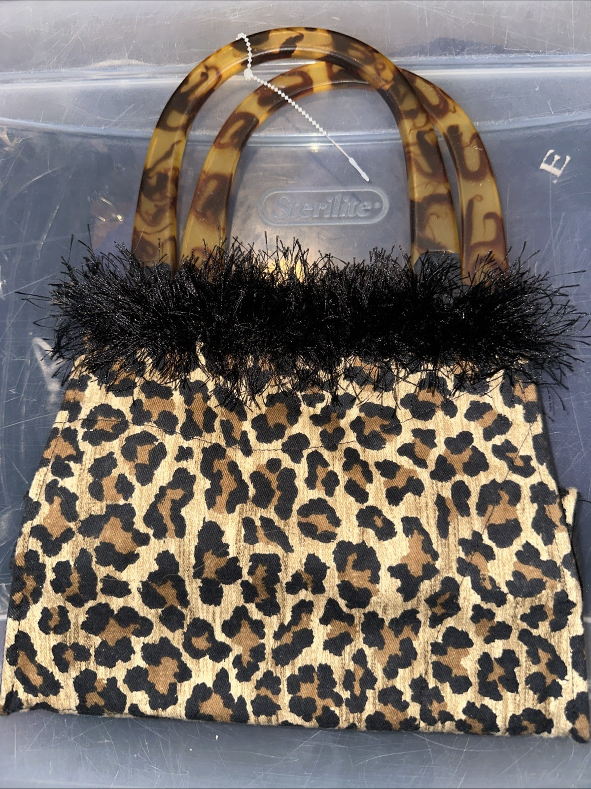 fuzzy small satchel handbag features a leopard print tortoiseshell-style handles