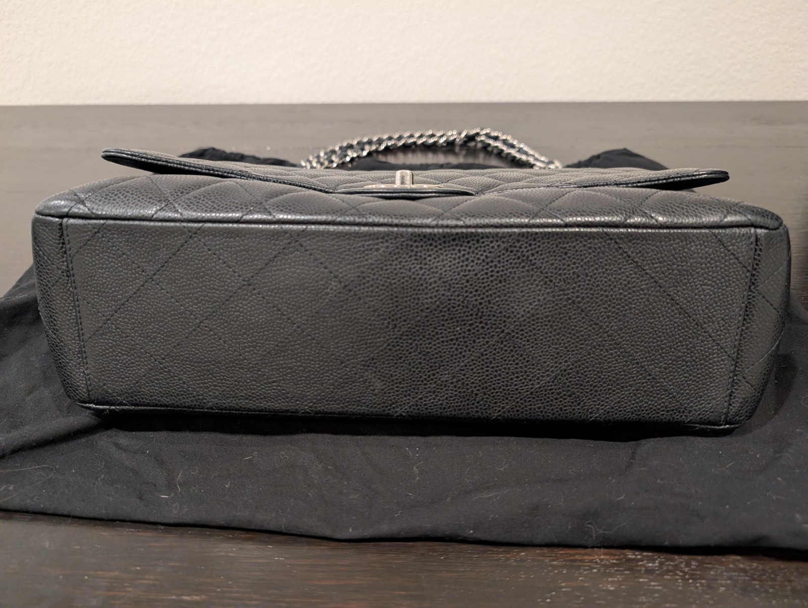 CHANEL Maxi Classic Double Flap Caviar Black Leather Bag. Circa 2011 Storyline