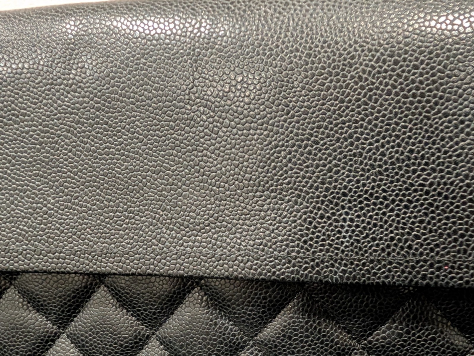CHANEL Maxi Classic Double Flap Caviar Black Leather Bag. Circa 2011 Storyline