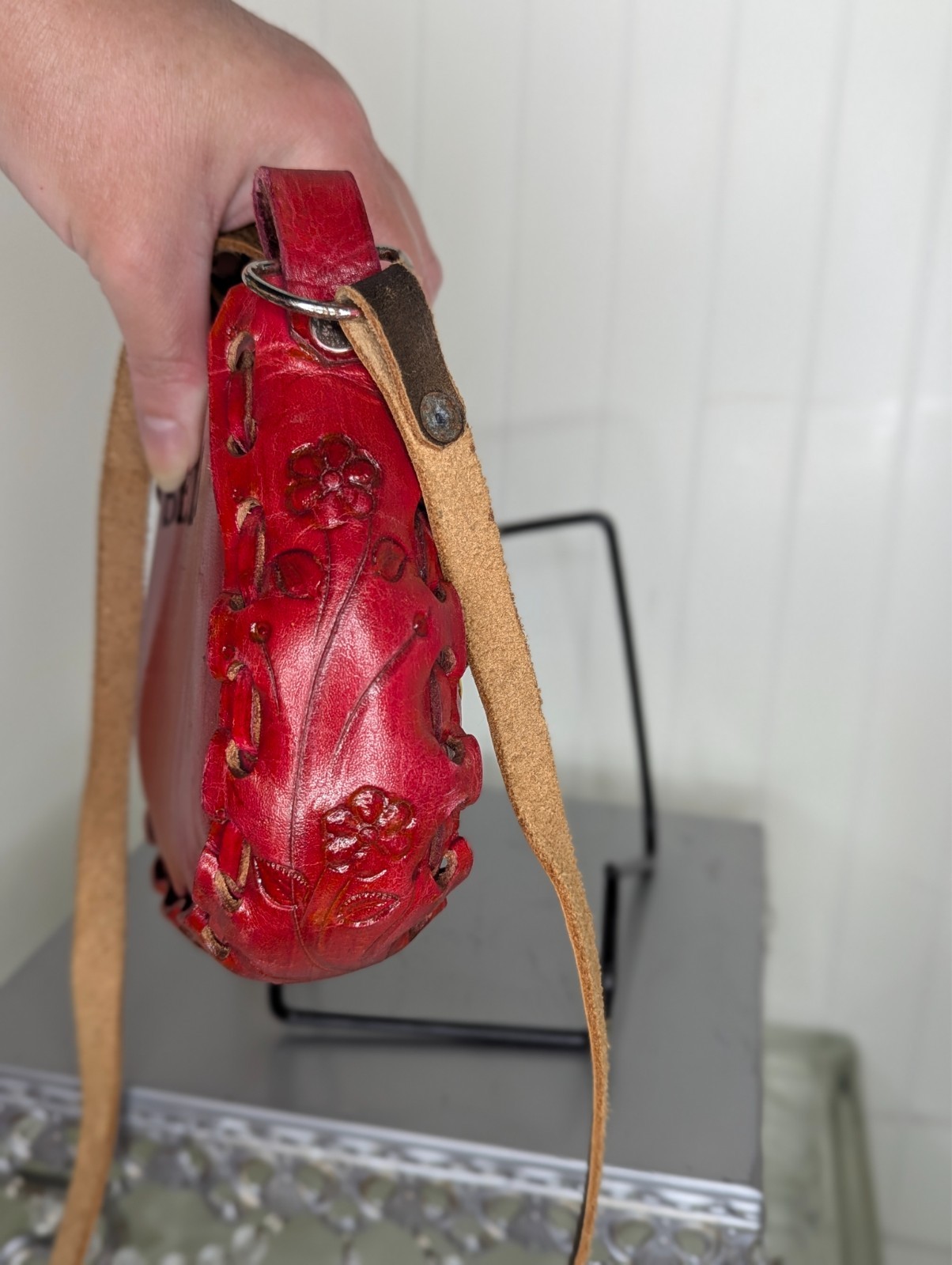 Red with flowers says Bella mexican hand tooled leather purse from Mexico