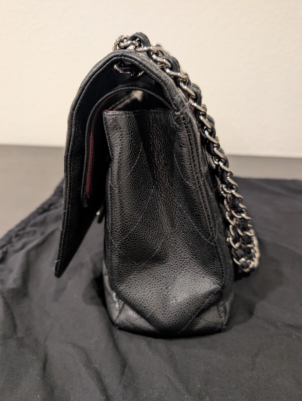 CHANEL Maxi Classic Double Flap Caviar Black Leather Bag. Circa 2011 Storyline