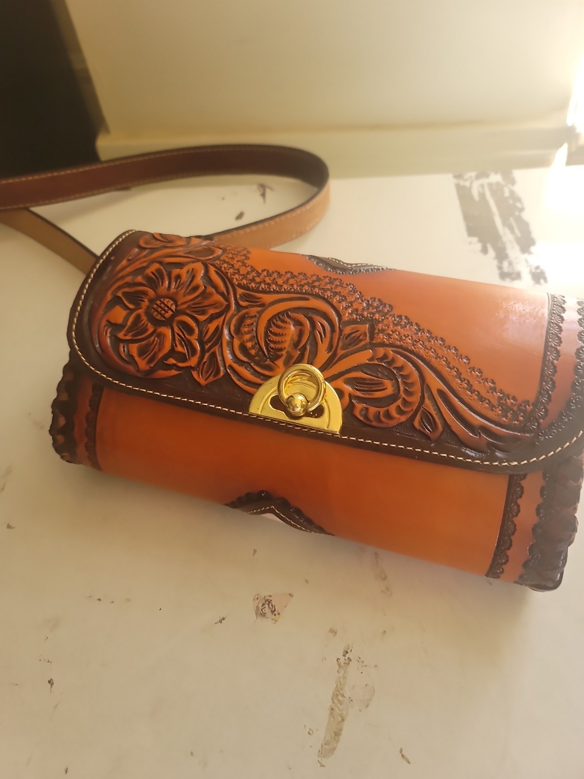 hand-tooled Western leather and hair-on-hide barrel bag