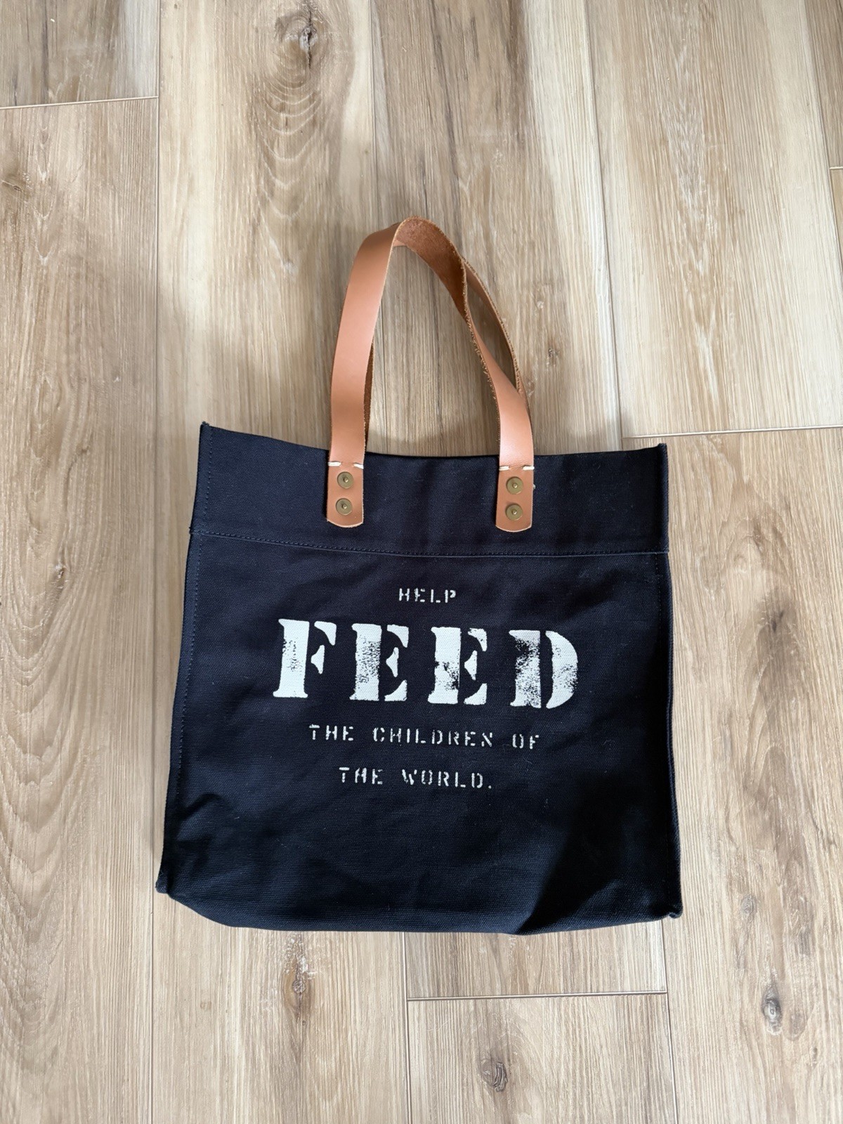FEED Children Of The World Black Tote Bag Brown Leather Handles 13in HELP