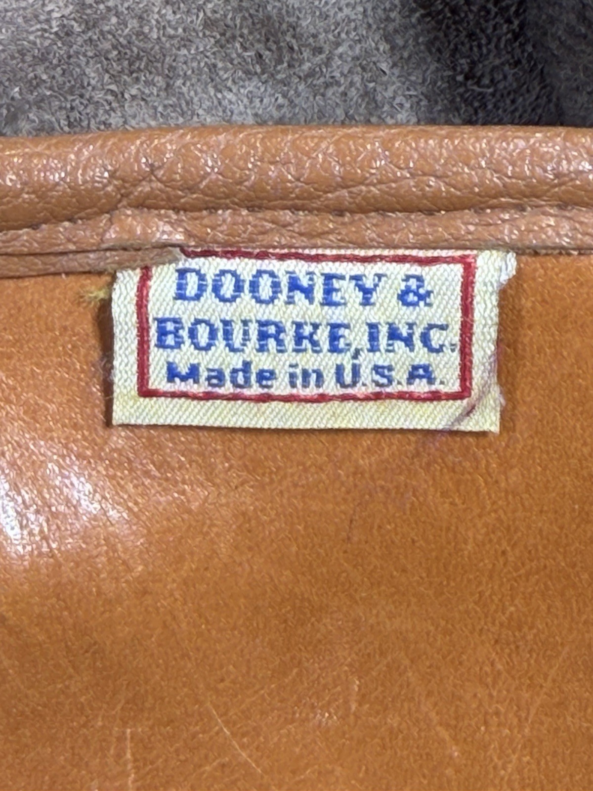 Vintage Dooney & Bourke Black Brown Pebbled Leather Drawstring Backpack Tassels