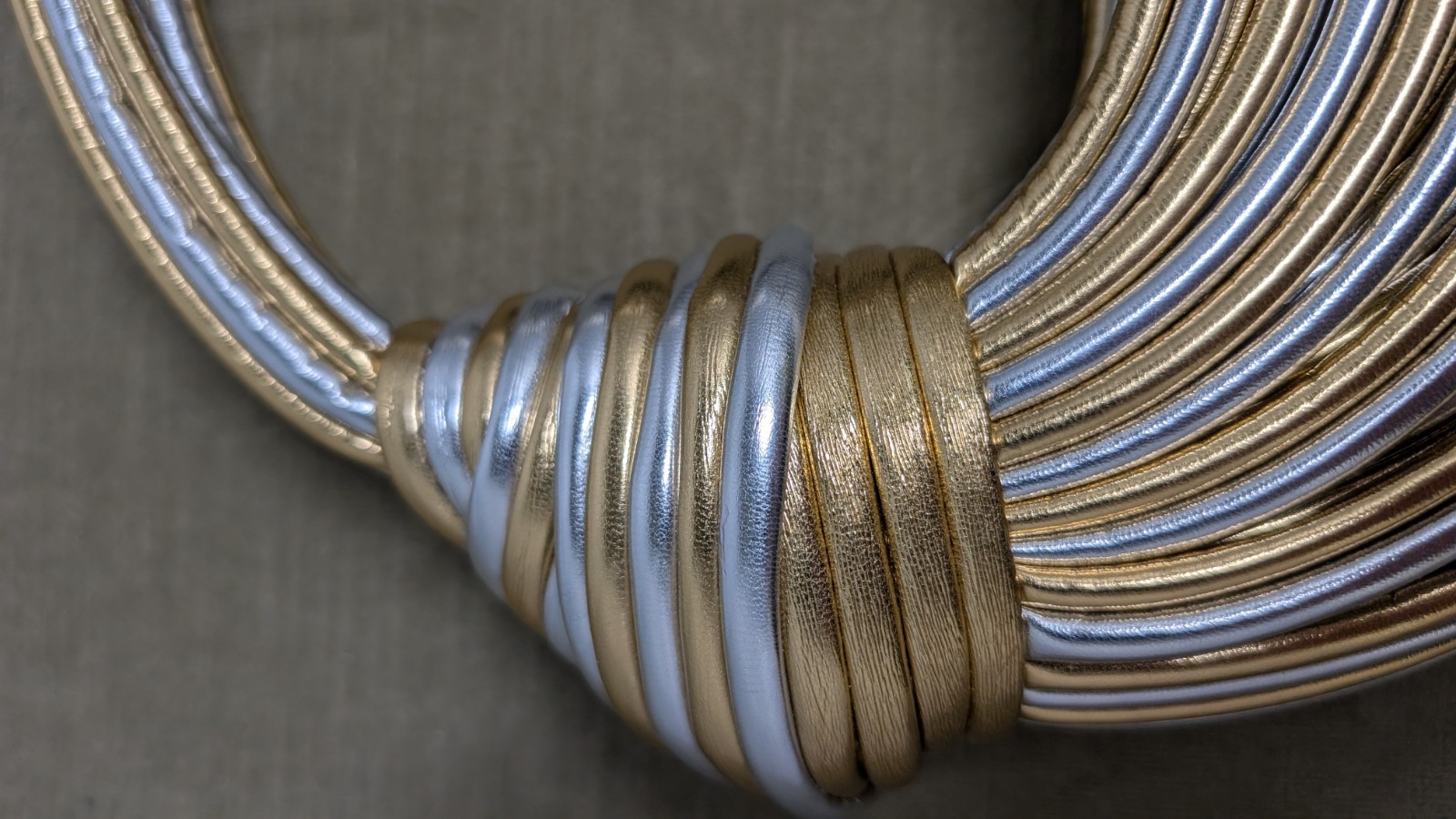 Metallic knotted noodle handbag in gold and silver colors Size 11″ x 10″ x 3″