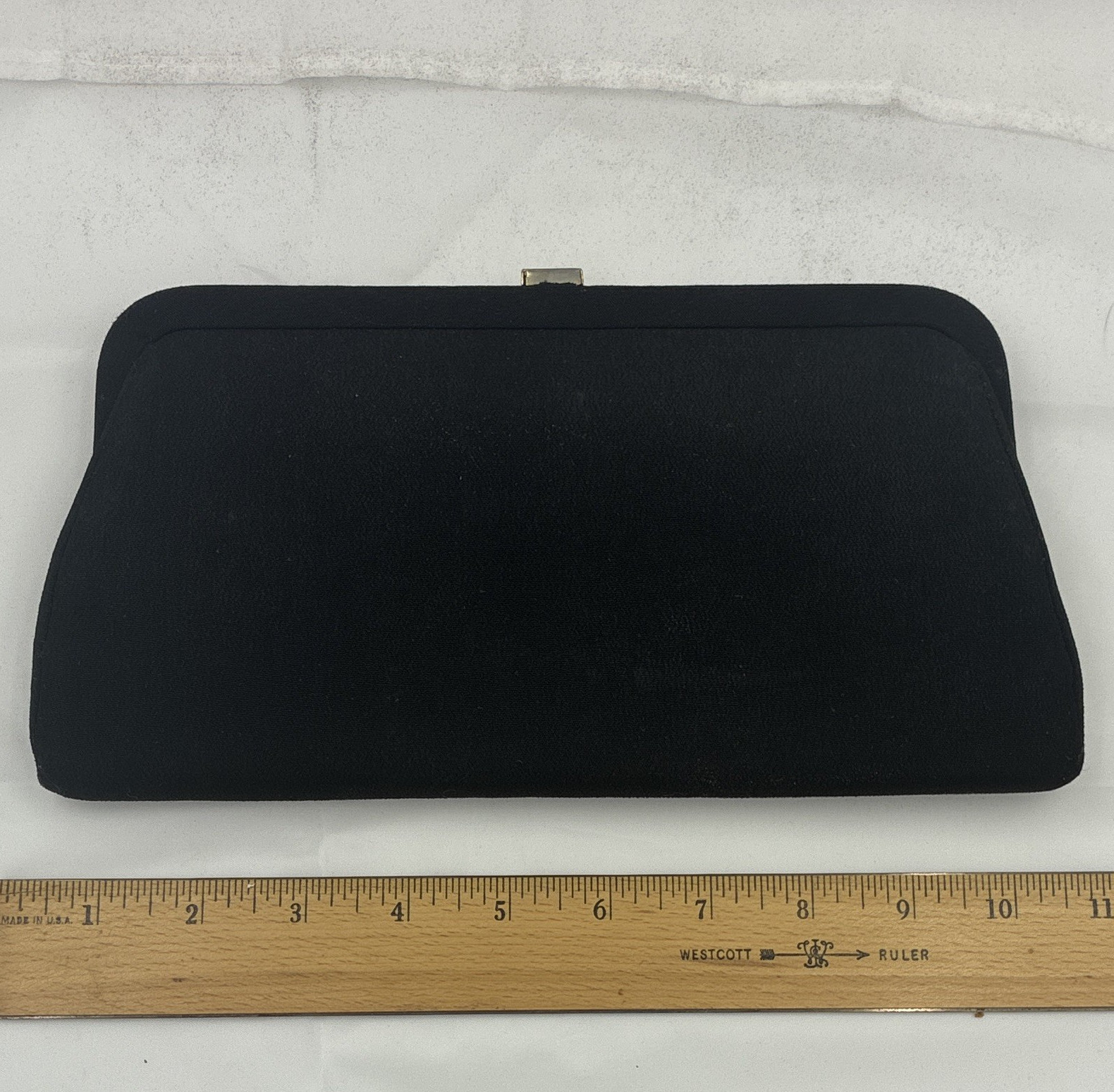 Vintage black structured clutch handbag , gold-toned frame and drop in handles