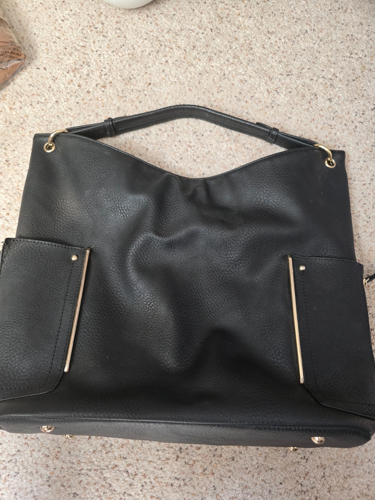 charming charlie purse with gold zippers, rings and side décor. Medium to large
