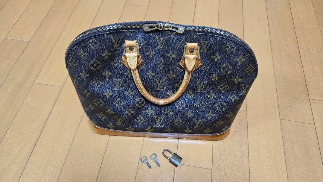 LOUIS VUITTON Monogram Alma Handbag Brown 320x170x245mm Padlock 2 Keys France