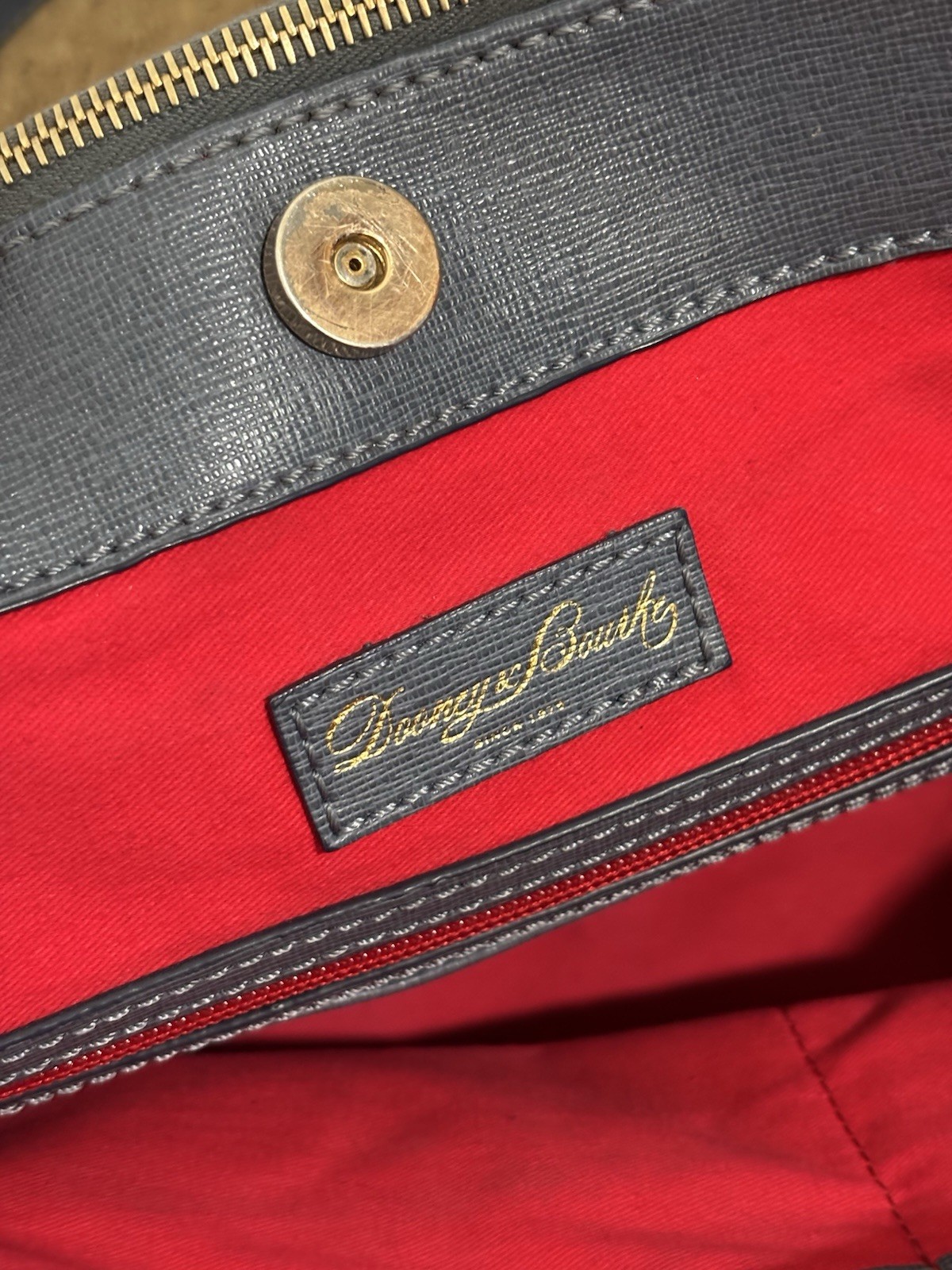 Dooney & Bourke Blue/grey satchel. Large enough to fit laptop. Red interior.