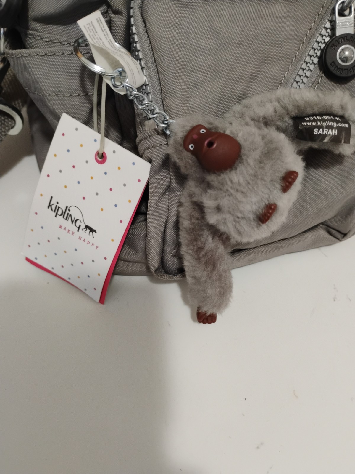 New With Tags Kipling Medium Crossbody Bag Grey W/Make Me Happy Monkey Keychain