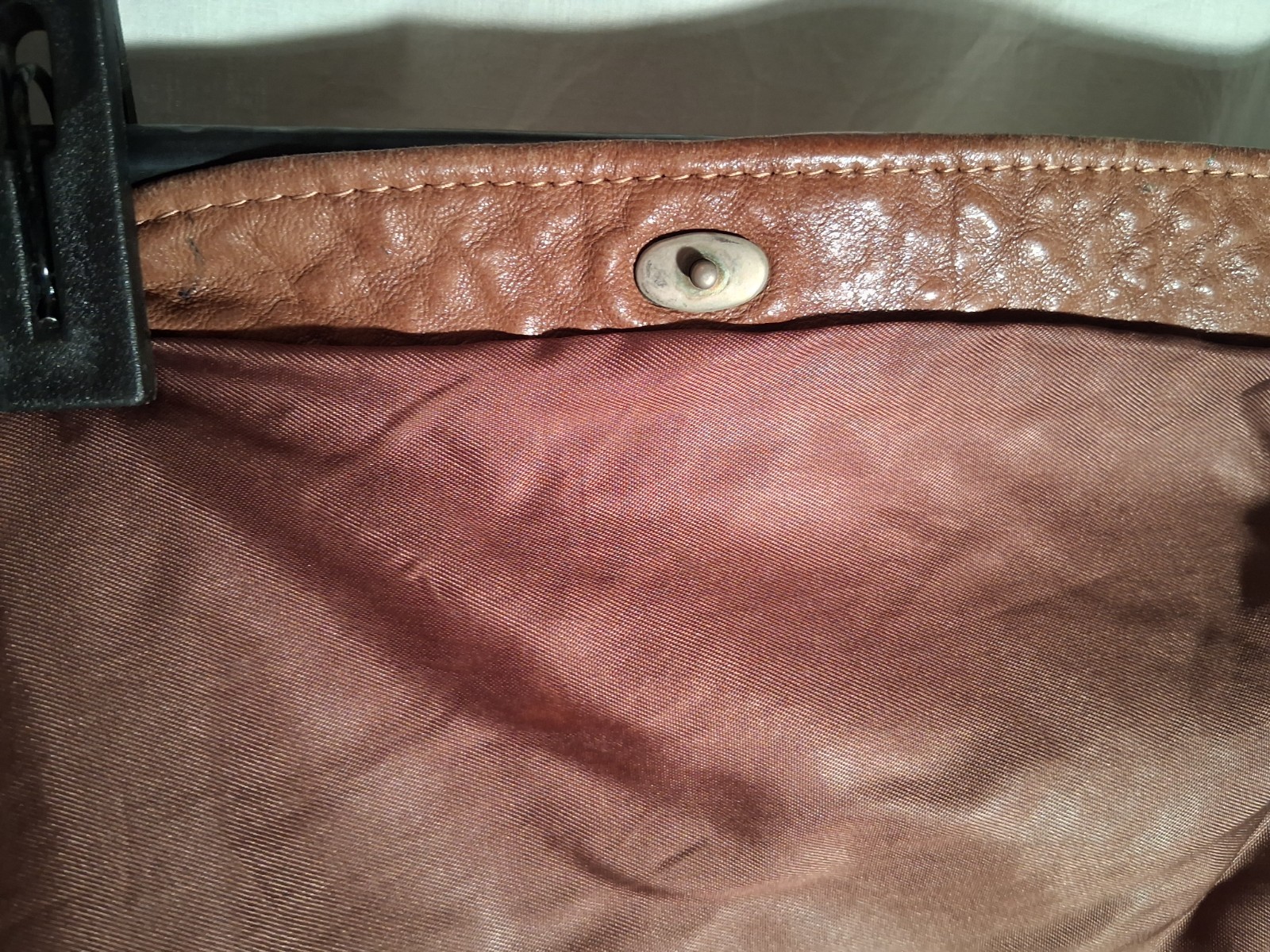 Chestnut supple leather saddlebag. 10″ high with flap closed. 16″ wide.