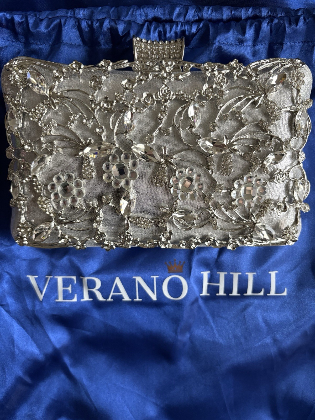 Verano Hill Silver crystal-embellished evening clutch bag.