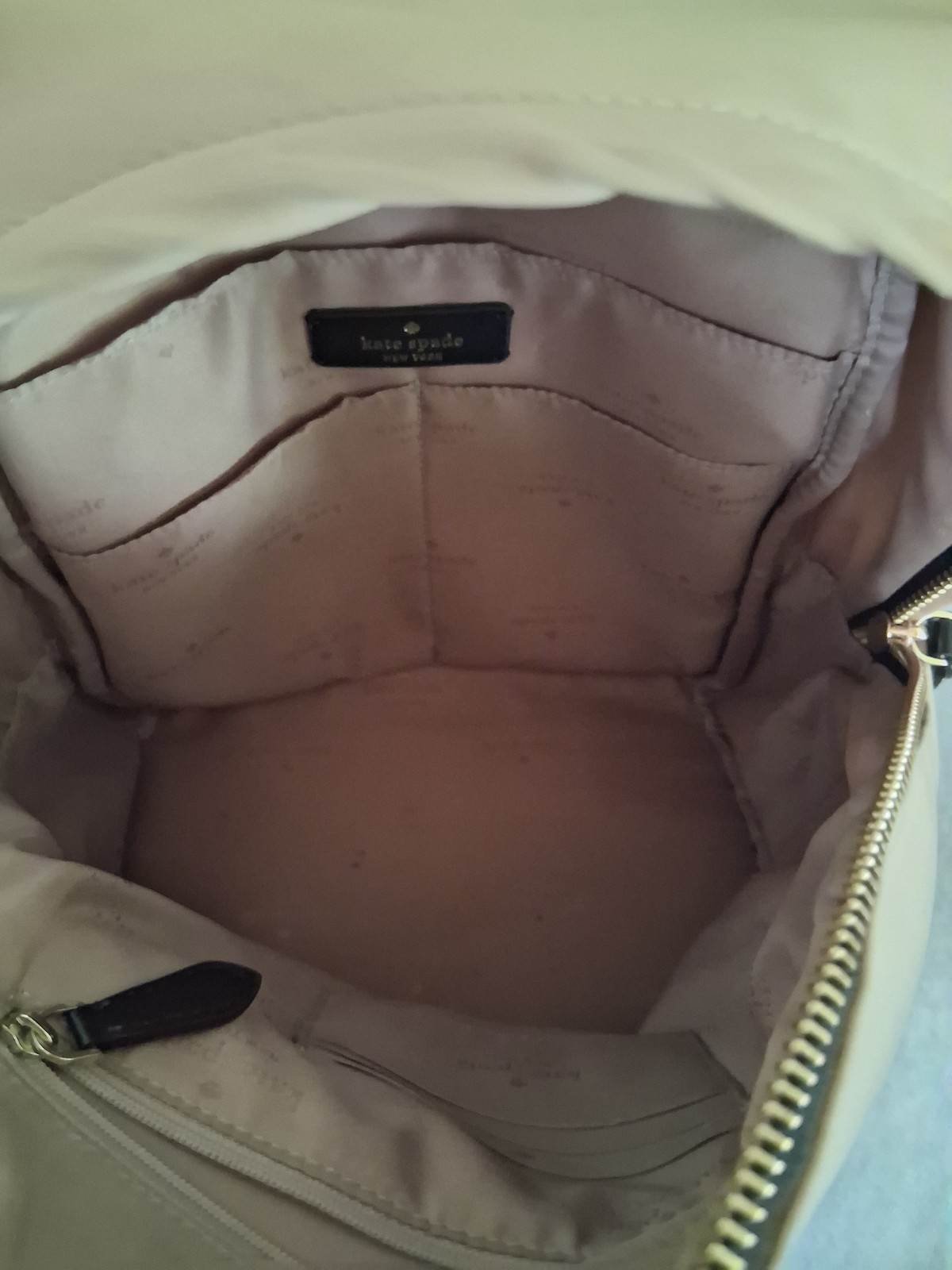 Kate Spade New York Beige Zip Backpack Gold Hardware Black Straps Logo Pockets