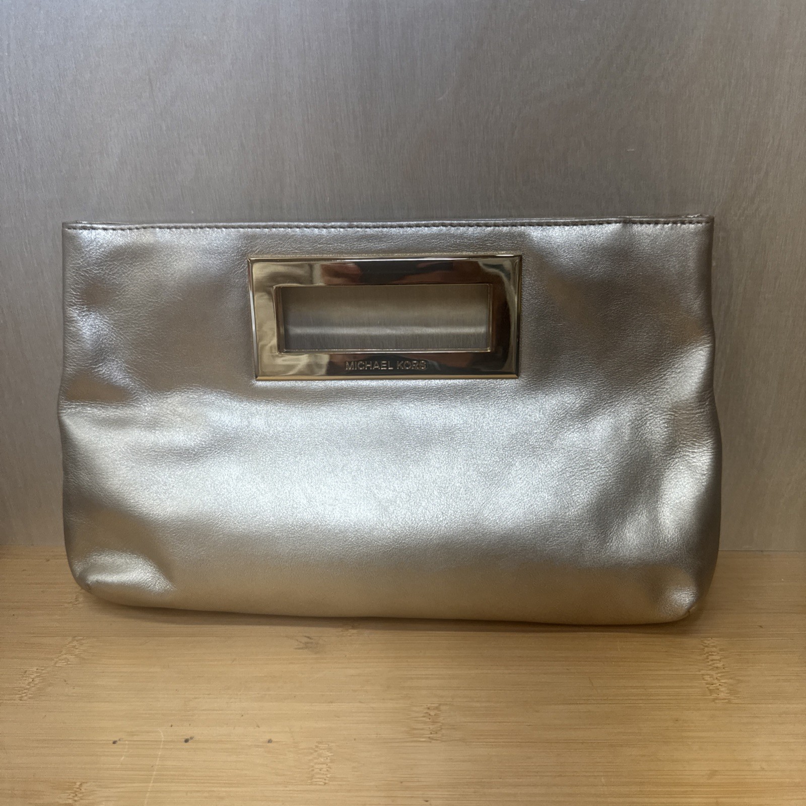 Classic Gold Michael Kors Berkley Leather Clutch Purse Handbag