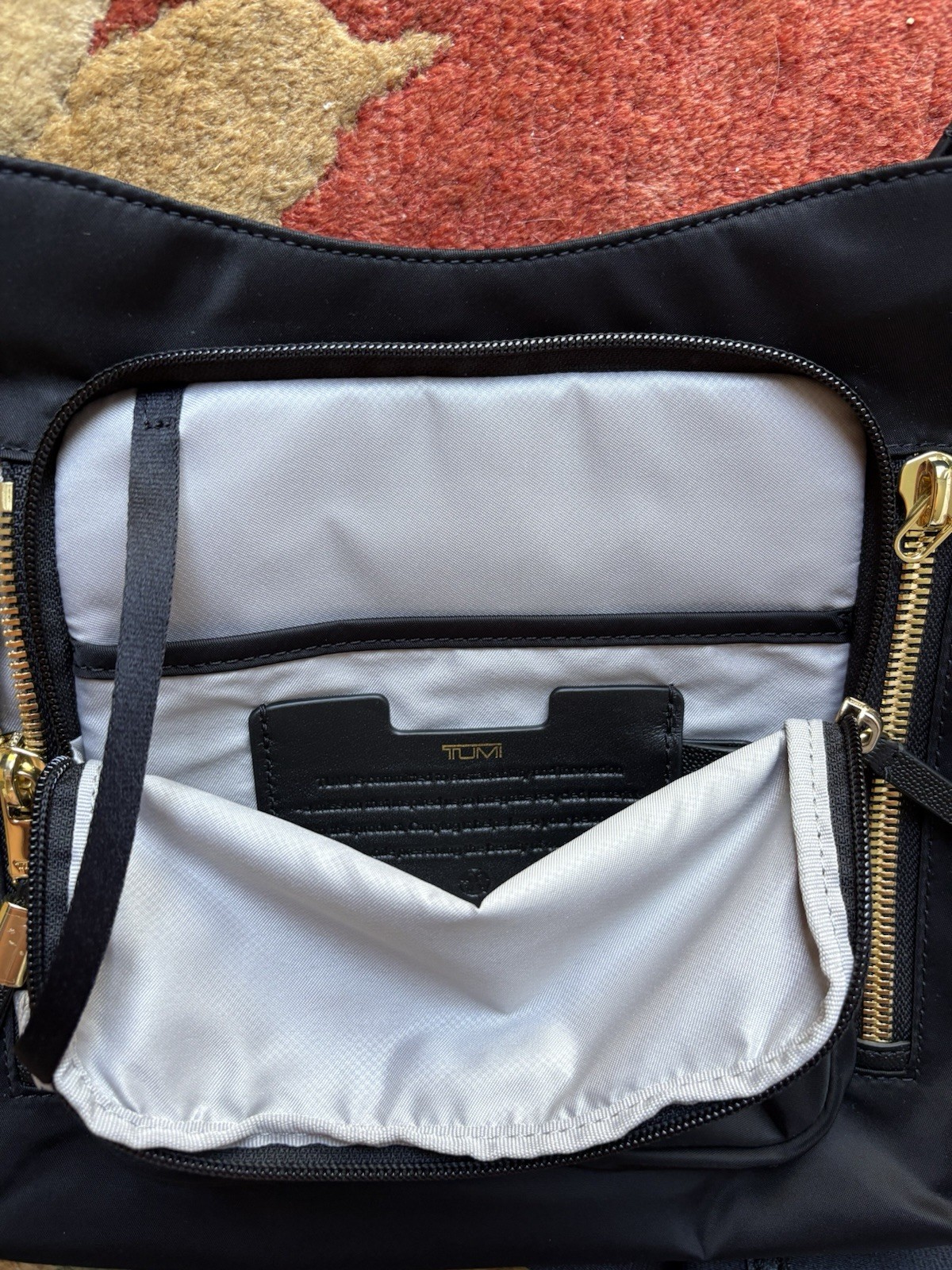 TUMI Voyageur Black Medium Crossbody Bag Zip Closure Gold Hardware travel